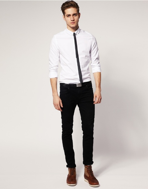 With black tie white shirt and brown boots